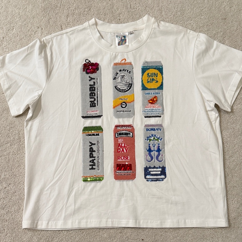 White Graphic T-Shirt with Colorful Can Designs